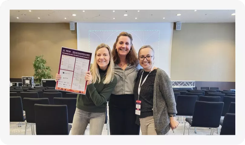 Nexo Team proudly presenting printed Agenda for the Nexo Annual Conference 2025