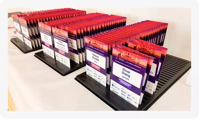 Printed Badges for the Nexo Annual Conference 2025 presented on a tray