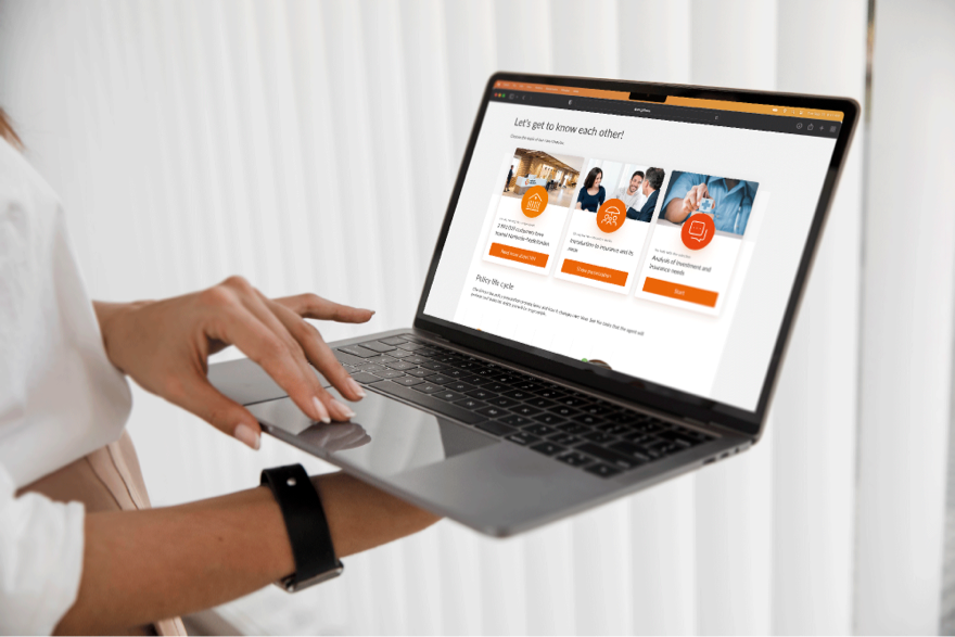 Image of the Conversation About Needs App displayed on a MackBook Pro held by a woman